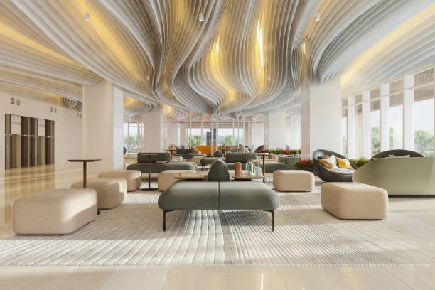 luxury hotel waiting area with armchairs, elevators and plants